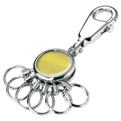 Abbildung von TROIKA Trend Waves Schlüsselanhänger mit Karabiner und 6 wechselbaren Ringen aus Metall in der Farbe Silber Gelb, Maße: 9cm x 2,5cm 0,9cm, KYR01 A186, Ringe