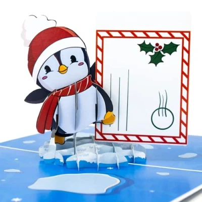 Abbildung von LIMAH® Pop Up 3D Grußkarte/Lustige Weihnachtskarte/Gutschein Karte, Geldgeschenk Karte zu Weihnachten/Motiv Pinguin mit einem Umschlag/in Blau/mit befüllbaren Umschlag