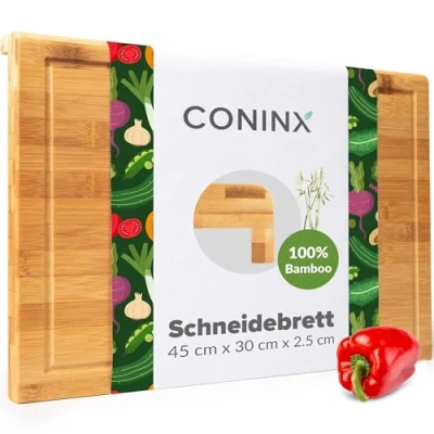 Abbildung von Coninx Schneidebrett Holz groß mit Saftrille Antibakterielles Moso Bambus Holzbrett zum Schneiden von Gemüse, Obst, Käse, Fleisch &amp; mehr Robustes Küchenbrett Servierbrett 45x30x2.5cm