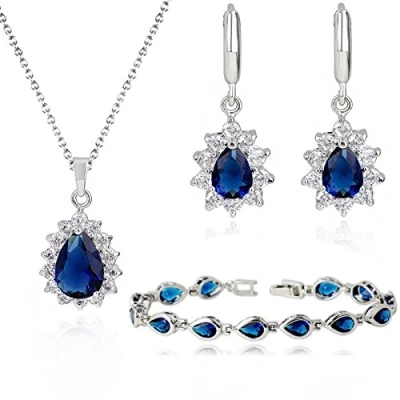 Abbildung von Crystalline Azuria Tropfenform 18 kt Vergoldet Blauer simulierter Saphir Zirkonia Kristalle Schmuck Set Halskette Ohrringe Armband