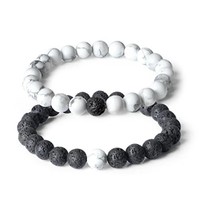 Abbildung von COAI Geschenkideen Glücksarmband aus Vulkanstein und Howlith ein Paar Partner Armbänder