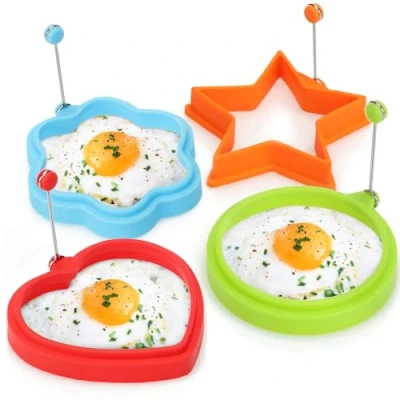 Abbildung von COM FOUR® 4x Omelettpfannenform Kreis, Blume, Stern und Herz für Spiegelei Pancake, Silikonform mit Hitzeschutzgriff Bratform Omelettpfannen (04 Stück Mix bunt)