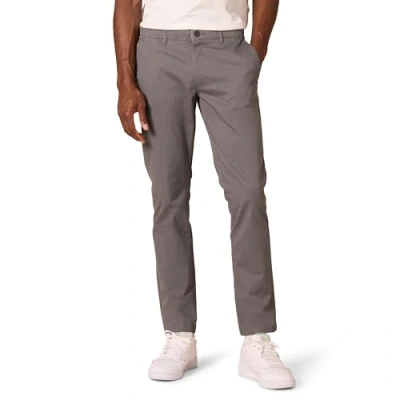 Abbildung von Amazon Essentials Herren Chinohose, Komfortabler, Gewaschener Stretch, Skinny Passform (Früher Goodthreads), Grau, 32W / 28L