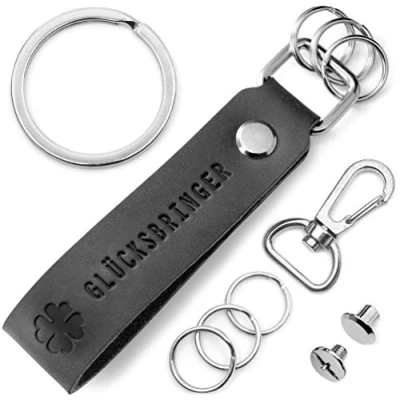 Abbildung von FABACH Leder Schlüsselanhänger mit wechselbarem Schlüsselring in Geschenkbox Kleeblatt Glücksbringer Gravur Kleiner Viel Glück Erfolg