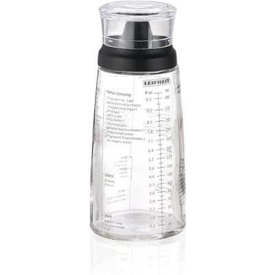 Abbildung von Leifheit Dressing Shaker, hochwertige Glasflasche mit verschiedenen Rezepten für Salatdressings, Messbecher tropffreien Ausguss, spülmaschinengeeigneter Dressingbehälter