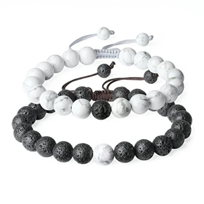 Abbildung von COAI® Geschenkidee Ein Paar Partner Armbänder aus Lavastein und Howlith für Damen Herren