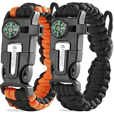 Abbildung von aZengear Paracord Überlebensarmband Feueranzünder aus Feuerstein und Stahl, Pfeife Kompass verstellbare Bandgröße für Camping, Bushcraft Notfallausrüstung (Schwarz Orange, Paar)