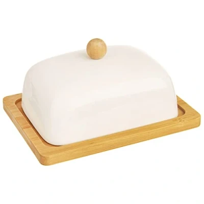 Abbildung von ORION GROUP Porzellan Butterdose mit Deckel Butterglocke aus Keramik 16x13x8,5 cm Weiß und Bambusholz Ökologischer Butterbehälter Perfekte Tisch Küchendekoration