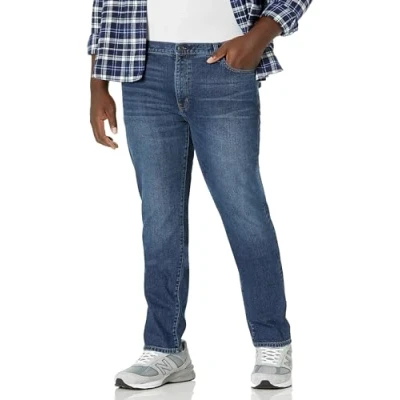Abbildung von Amazon Essentials Herren Stretchjeans, Skinny Passform, Mittlere Waschung, 36W / 34L