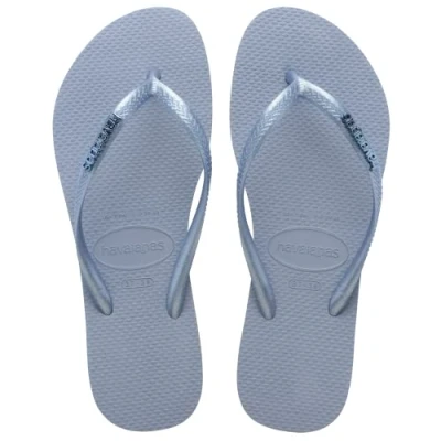 Abbildung von Havaianas Damen Slim Logo Metallic Flipflop, Ashley Blue, 33/34