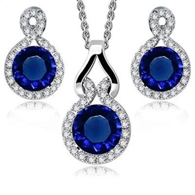 Abbildung von Crystalline Azuria Rund Blauer simulierter Saphir Zirkonia Kristalle Schmuck Set Halskette Anhänger 45 cm Ohrringe 18 kt Weiß Vergoldet