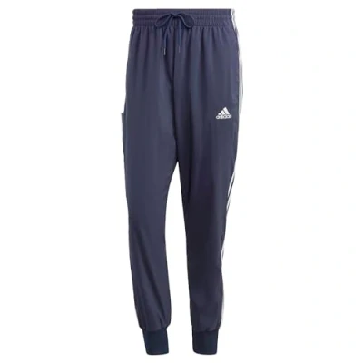 Abbildung von adidas Herren AEROREADY Essentials Tapered Cuff Woven 3 Stripes Pants, Legend Ink/White, M