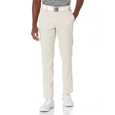 Abbildung von Amazon Essentials Herren Golf Stretchhose, Schmale Passform, Stone, 36W / 28L