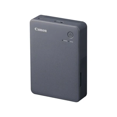 Abbildung von Canon SELPHY QX20 mobiler Fotodrucker per WLAN direkt vom Smartphone drucken. Thermosublimationsdruck, 2 Größen Stickerpapier und Laden USB C Dunkelgrau