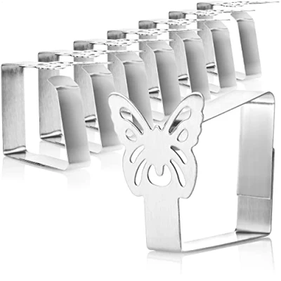 Abbildung von com four® 8x Premium Tischtuchklammern aus Edelstahl Tuchhalter für Tafelwäsche Tischklammern innen und außen mit Dekor moderne Tischklemmen Metallspangen (08 Stück/Schmetterling)