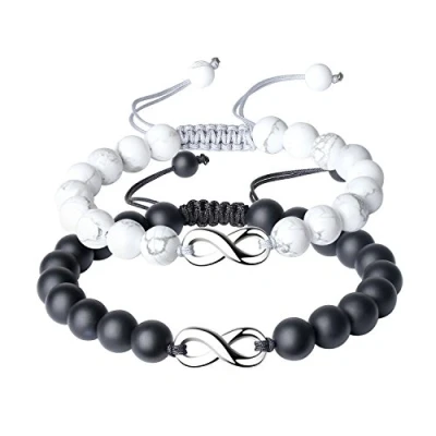 Abbildung von COAI Geschenkideen Kristall Armbänder aus Howlith und Mattem Onyx mit Infinity Charm Ein Paar Partner