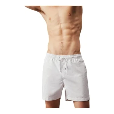 Abbildung von Calvin Klein Herren Badehose Medium Drawstring Lang, Weiß (Pvh Classic White), XL