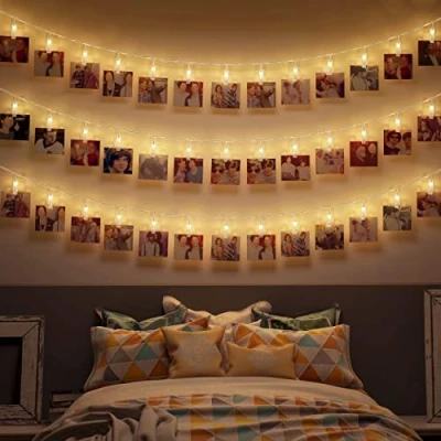Abbildung von B.K.Licht 5m LED Foto Lichterkette mit batteriebetrieb (exkl.), 40 Clips, super warmweiße Lichtfarbe, Weihnachstdeko, Innen, Wanddeko, Zimmer Deko, Fotowand, 500 cm, Transparent