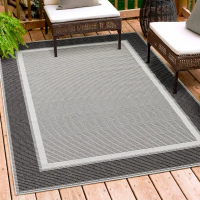 Abbildung von andiamo In und Outdoor Teppich wetterfest Arizona Balkon wasserfest auch nutzbar als Wohnzimmerteppich oder Küchenteppich Anthrazit Bordüre 67 x 140 cm