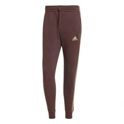 Abbildung von adidas Sportswear Sporthose »ESSENTIALS 3STREIFEN TAPERED CUFF HOSE«, (1 tlg.), Jogginghose aus Baumwollmix