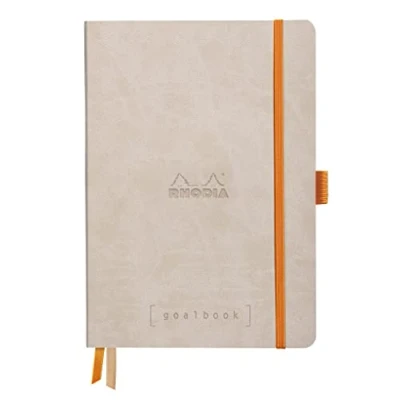 Abbildung von Rhodia 117765C Notizheft Goalbook (DIN A5, 14,8 x 21 cm, kariert, praktisch und trendige, mit weichem Deckel, 90g, elfenbeinfarbigem Papier, 120 Blatt, Gummizug, Lesezeichen) 1 Stück, Beige