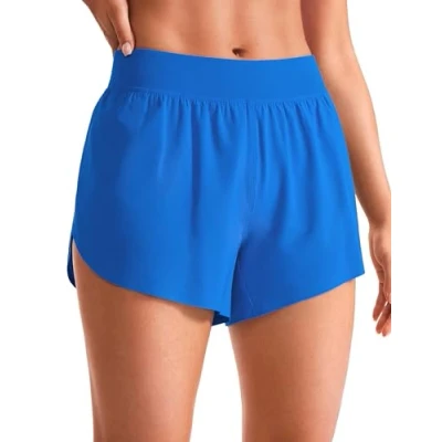 Abbildung von CRZ YOGA Damen Mid Waist Running Shorts Seitliche Splits Sport Workout Kurze Hose Leichte Atmungsaktive Sporthose Laufhose Funkelndes Blau 34