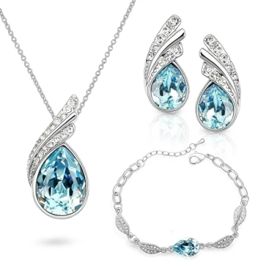 Abbildung von Crystalline Azuria Tropfenform Kristalle Blau Simulierter Aquamarin Schmuck Set Halskette Ohrringe Armband 18 kt Weiß Vergoldet