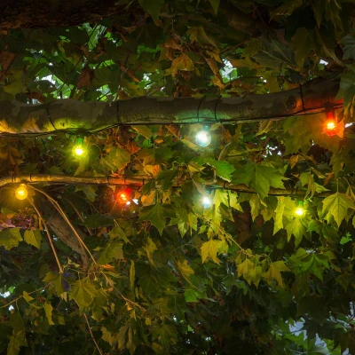 Abbildung von Konstsmide LED Biergartenketten System Erweiterung Lichterkette, 10 bunte Birnen / 80 warm weiße Dioden, Außen (IP44), schwarzes Kabel 2397 500