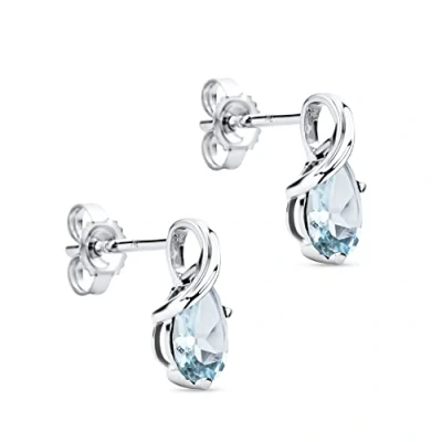 Abbildung von Orovi Ohrringe Tropfenform aus 9 Karat Weißgold (375) mit Topas (0,91 ct) Gold Ohrstecker Damen Edelstein in edler Krappenfassung Goldohrringe allergenfrei &amp; handgemacht (10 x 4.5 mm)