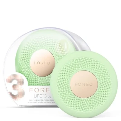 Abbildung von FOREO UFO 3 go Gesichtsmasken Hautpflegegerät unterwegs Feuchtigkeitscreme Anti Aging Pflege Vollspektrum LED und Rotlichttherapie Thermotherapie T Sonic Massage kompakt Pistachio
