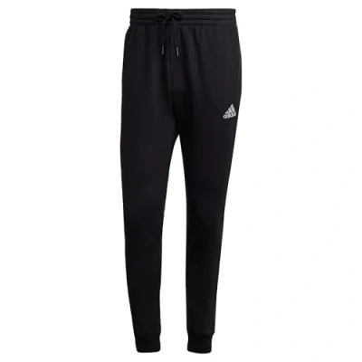 Abbildung von adidas Herren Essentials Fleece Regular Tapered Pants, Black / White, L Tall 2 inch