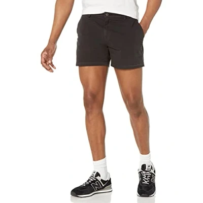 Abbildung von Amazon Essentials Herren Flatfront Chinoshorts, Komfortabler Stretch, 13 cm Schrittlänge, Schmale Passform (Früher Goodthreads), Schwarz, 32W