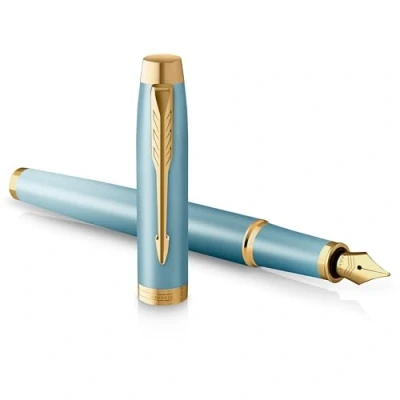 Abbildung von Parker IM Writing Rituals Füller, grünes Gehäuse mit Farbverlauf, goldene Zierteile, Füllfederhalter Feiner Feder, blaue Tinte, Geschenkbox
